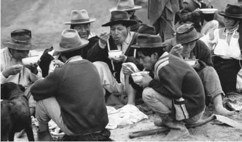 Community workers take a lunch break in Mariano Acosta. In Ecuador, national identity is a state system that owes the poor a livelihood.